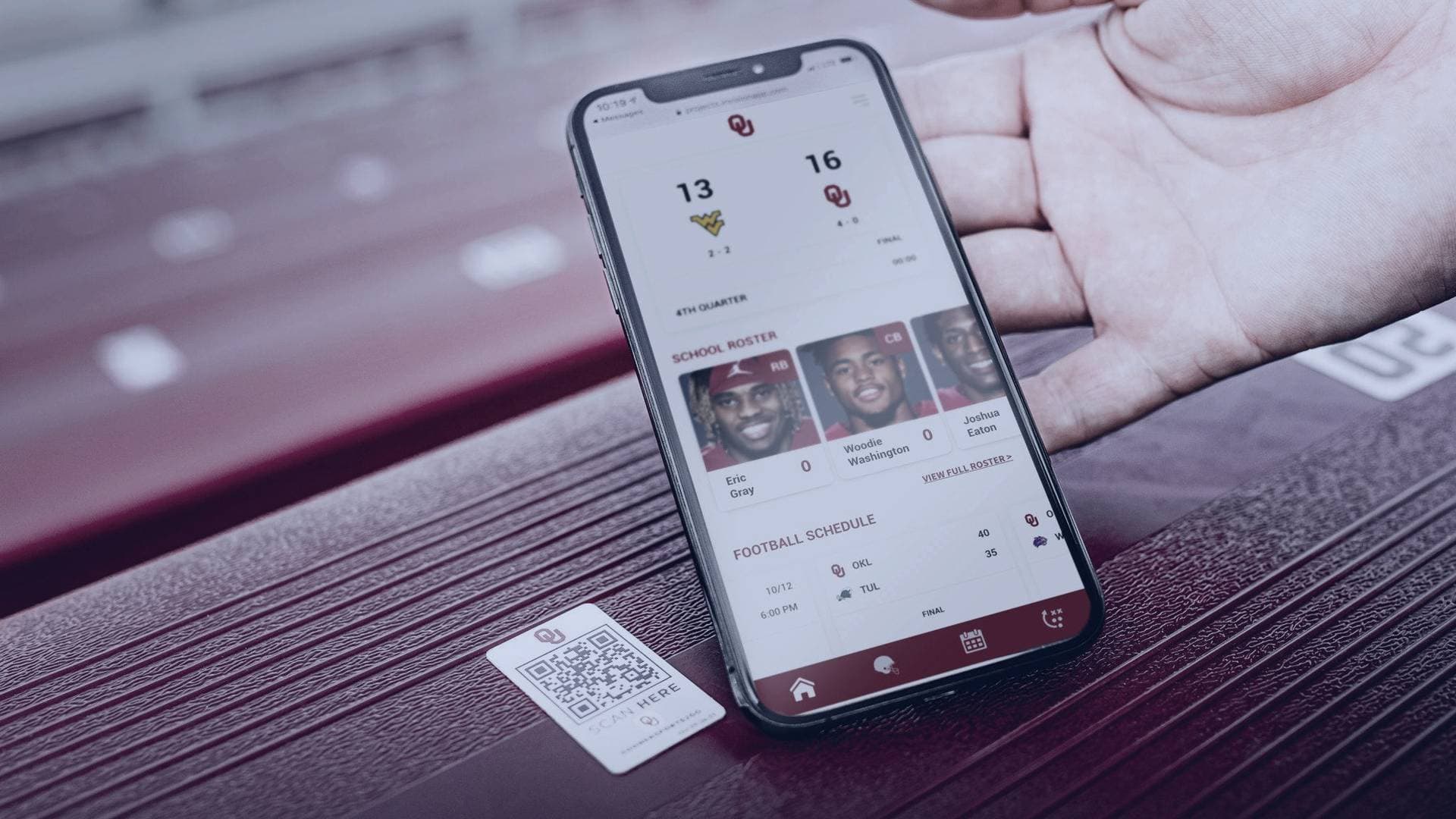 Fan checking the DigitalSeat experience on their phone from the stadium stands